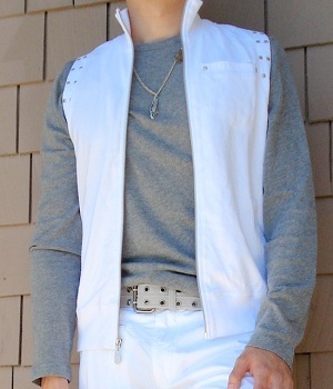 A gray long sleeve T-shirt, a white vest, a pair of white pants