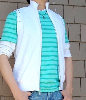 Green T-Shirt Between White T-Shirt And White Fashion Vest