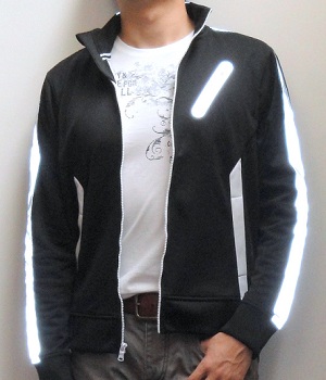 Black track jacket paired with a White graphic tee