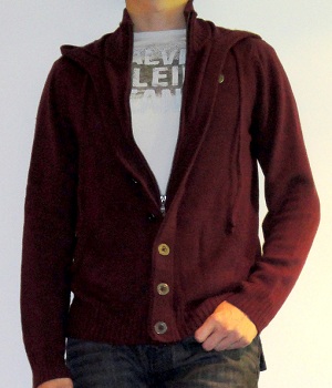 Dark red hoodie cardigan over white graphic tee