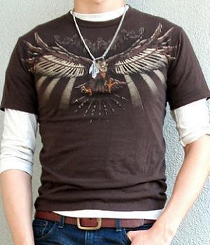 Brown graphic tee paired with dark blue jeans