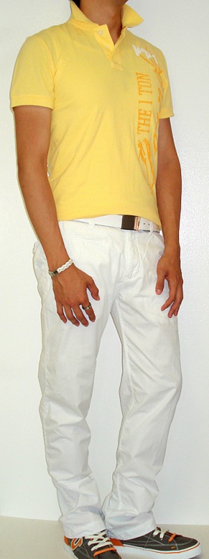 Yellow Graphic Tee White Belt White Pants Gray Shoes